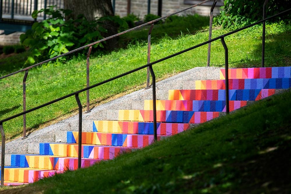 The stairs up to St. Nicholas Church are illuminated by a colorful work of art in different geometric shapes that carry the steps between different ages. You probably can't help but be happy when you see this fantastic staircase!